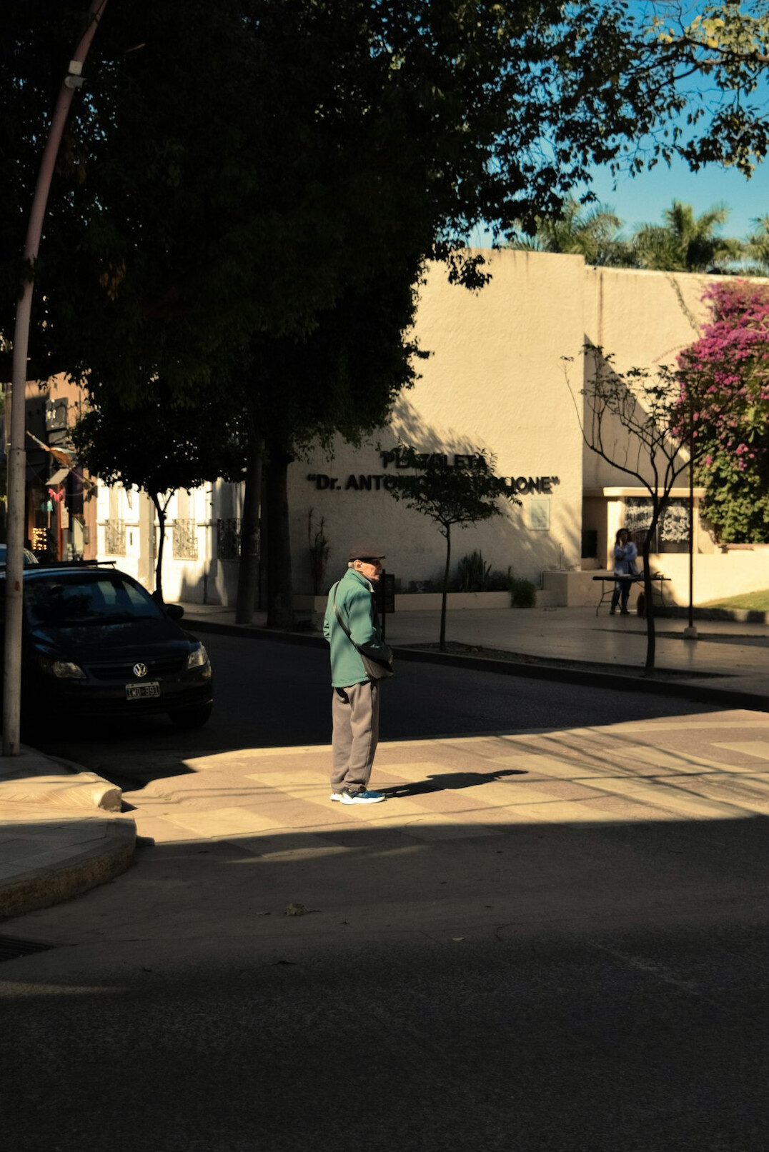 Neighbors chatting on a street corner in a Chilean barrio