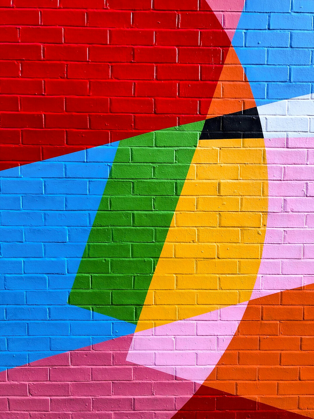 Large colorful street art mural on a Valparaíso building